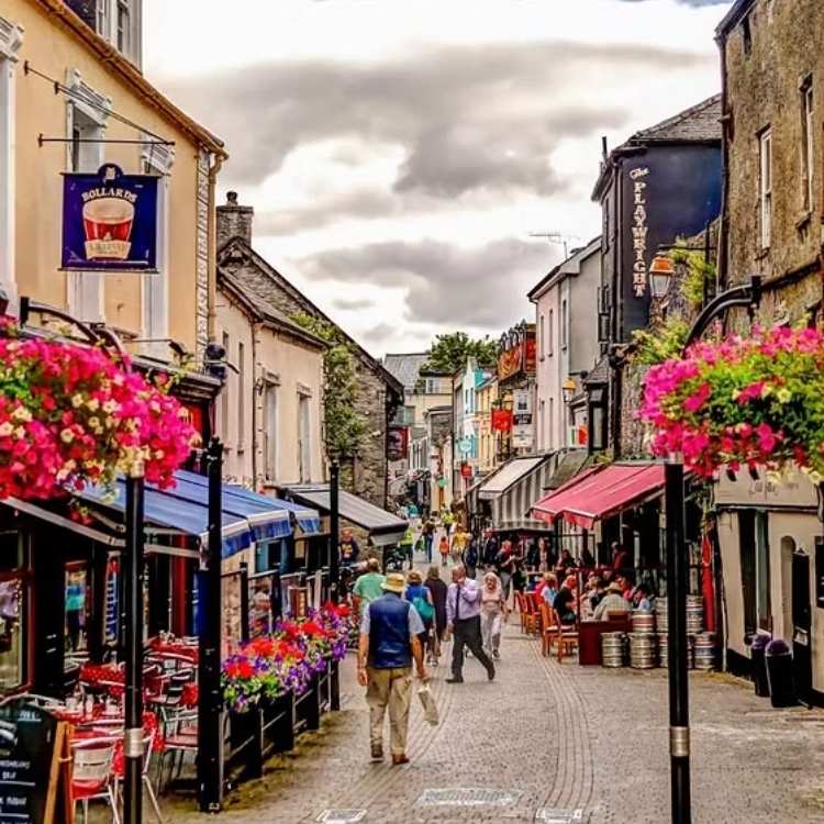 Historic street in Kilkenny city featuring colourful shopfronts and traditional Irish architecture during a private Kilkenny tour.