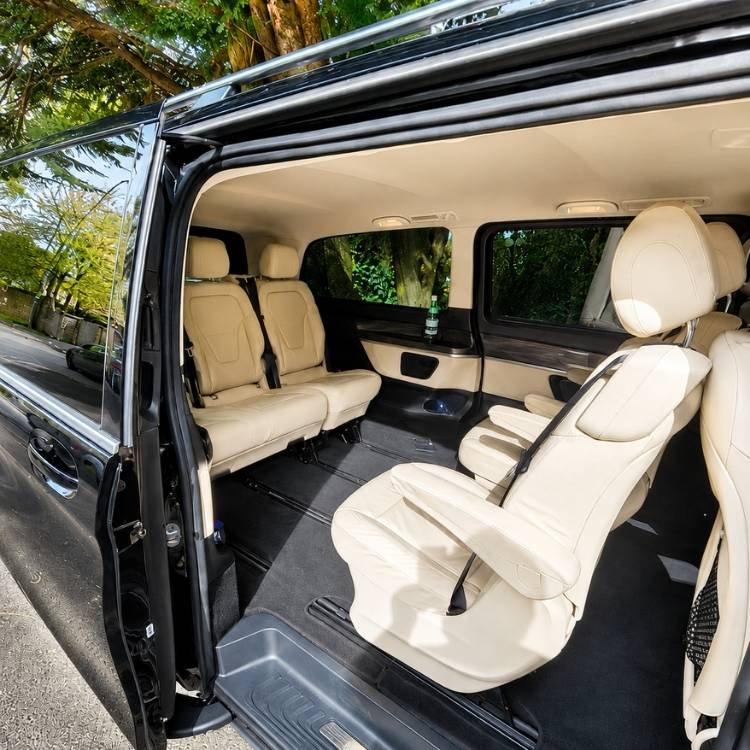 Wedding transportation luxury Mercedes interior with spacious leather seating for couples and wedding guests.